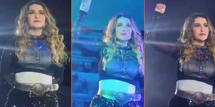 Alicia Villarreal hace la Señal de Auxilio en un show para denunciar violencia de su esposo